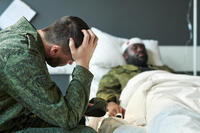 A soldier mourns an injury to a fellow service member. New legislation introduced March 9, 2026, could open the door for more psychedelics being used for a variety of conditions. (Shutterstock)