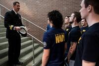 Navy recruits and a recruiter.