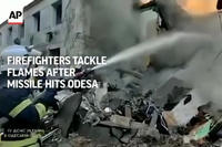 Firefighters Tackle Flames After Missile Hits Odesa