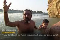 Iraqis Cool off in River as Heatwave Hits