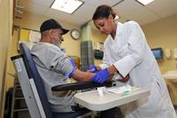 A veteran has his blood drawn for testing at a VA clinic. (image: va.gov)