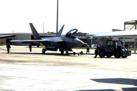 An F-22 Raptor is towed to its hangar on Feb. 27 at Tyndall Air Force Base, Fla. (Military.com photo/Oriana Pawlyk)
