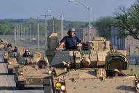 Several dozen of the Army's M2A3 Bradley Fighting Vehicles travel Fort Riley roads on their way to 2nd Heavy Brigade Combat Team, 1st Infantry Division motor pools April 10, 2012 (U.S. Army/Mollie Miller.)