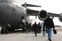 Space-A travellers are loaded into a C-17 headed for Dover Air Force Base, Del., April 21, 2008. (Photo: U.S. Air Force)
