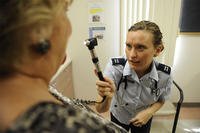 Dr. (Capt.) Nicole Wilson-Hall, examines a military family member in Belleville, Ill. (U.S. Air Force Photo/Staff Sgt. Ryan Crane)