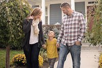 A couple with their young daughter