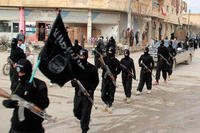 In this undated file image posted on a militant website on Tuesday, Jan. 14, 2014, fighters from the al-Qaida linked Islamic State group, march in Raqqa, Syria. (AP Photo/File)