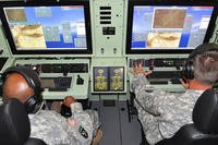 Students from the Non-Commissioned Officer Academy train in a universal mission simulator. (U.S. Army photo)