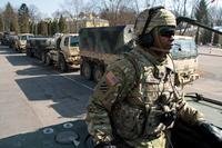Dragoons from 3rd Squadron, 2nd Cavalry Regiment wave to the crowd during an event March 24 in the city center of Bialystok, Poland. (U.S. Army photo by Sgt. Brandon Hubbard)