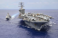 The aircraft carrier USS Nimitz conducts a replenishment-at-sea with the Royal New Zealand navy Anzac-class frigate HMNZS Te Kaha in the Philippine Sea, July 2, 2017. (U.S. Navy photo/Mass Communication Specialist 3rd Class Ian Kinkead)