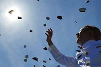 Cadets throw their covers into the air as they officialy become ensigns during the 133rd commencement exercises at the U.S. Coast Guard Academy in New London, Conn., May 21, 2014.