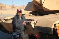 Kenny R. White, Marine veteran, native of San Diego, Calif., hugs a tank on the 1st Tank Battalion ramp, Dec. 22, 2014. Photo By: Lance Cpl. Medina Ayala-Lo