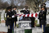 A soldier salutes during a graveside service for Anthony La Rossa in Farmingdale, N.Y., Monday, Dec. 15, 2014. (AP Photo/Seth Wenig)