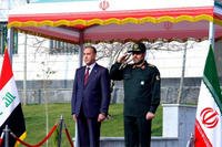 This photo released by the Iranian Defense Ministry shows, Iranian Defense Minister Hossein Dehghan, right, and his Iraqi counterpart Khalid al-Obeidi. (AP Photo/Iranian Defense Ministry)