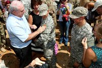 Family members pin Ranger Tabs on Capt. Kristen Griest and 1st Lt. Shaye Haver. (Photo by Matthew Cox/Military.com)