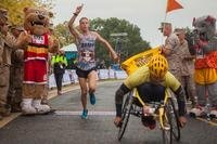 Trevor Lafontaine, the first male finisher, completes 40th Marine Corps Marathon at Arlington, Virginia, Oct. 25. LaFontaine finished the 26.2-mile race in 2:24. (Photo By: Sgt. Justin M. Boling)