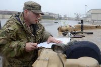 U.S. Army Staff Sgt. Christopher Couture, a tank commander with Company C, 3rd Battalion, 69th Armor Regiment, turning in gear to the European Activity Set at Coleman Worksite in Mannheim, Germany. (U.S. Army/Rick Scavetta)