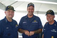 Coast Guard Chief Petty Officer Richard Sambenedetto poses with Adm. Thad Allen, the 23rd Commandant of the Coast Guard, and the 10th Master Chief Petty Officer of the Coast Guard Charles “Skip” Bowen. (U.S. Coast Guard)