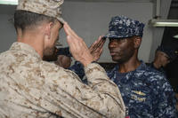 Gen. Francis Donovan, commander, Task Force 51, receives a salute from Capt. Keith Moore as Moore relinquishes command of Amphibious Squadron One during a change of command ceremony. (Photo: Mass Communication Specialist 3rd Class Michael T. Eckelbecker)