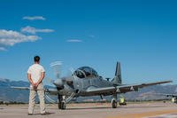 An Afghan maintainer waits as an 81st Fighter Squadron instructor pilot and Afghan pilot get ready to take off for high-altitude training at Peterson Air Force Base, Colo., Sept. 16, 2015. (U.S. Air Force photo/Airman 1st Class Rose Gudex)
