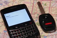 Cell phone and key on map.