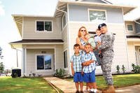 military family in front of house