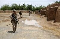 Lance Cpl. Cody Kelley, machine gunner, Bravo Company, 1st Battalion, 7th Marine Regiment, patrols with an M240B medium machine gun during a mission in Helmand province, Afghanistan, May 15, 2014. (Photo by Joseph Scanlan/U.S. Marine Corps)