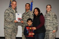Staff Sgt. Vikas Kumar receives the STEP promotion to technical sergeant from Col. Brian Newberry, the 92nd Air Refueling Wing commander, and Chief Master Sgt. Wendy Hansen, the 92nd Air Refueling Wing command chief. (U.S. Air Force/A1C Sam Fogleman)