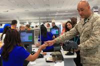 A Marine shops at the grand opening of a new Marine Corps Exchange on May 3, 2012, on Camp Pendleton in California. (Marine Corps photo)