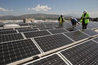 solar panels and workers