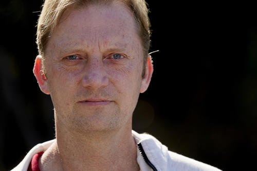 U.S. Navy veteran Michael White stands for a portrait.