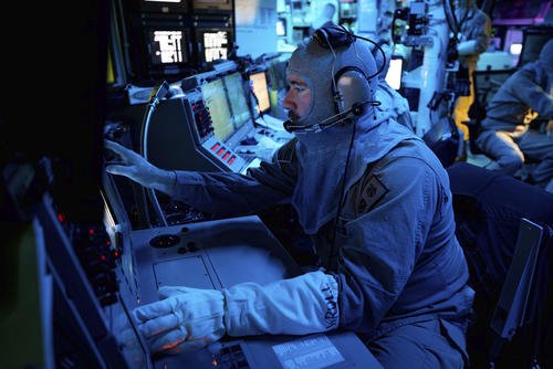 USS Carney (DDG 64) combat systems coordinator console in the combat information center