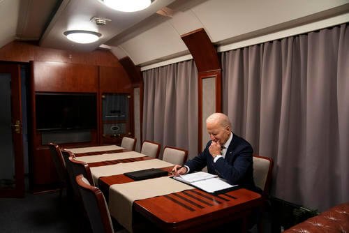 President Joe Biden sits on a train.