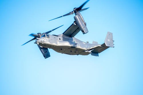 A CV-22B Osprey from the 352nd Special Operations Wing conducts a flyover at a Veterans Day ceremony at Cambridge American Cemetery and Memorial, Cambridge, England.