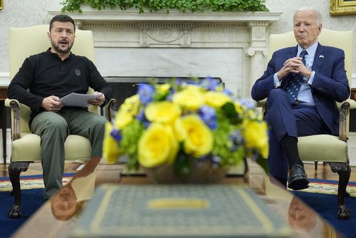 President Joe Biden listens as Ukraine's President Volodymyr Zelenskyy speaks during their meeting.