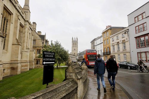 People walk around Oxford University's campus on Sept. 3, 2017.