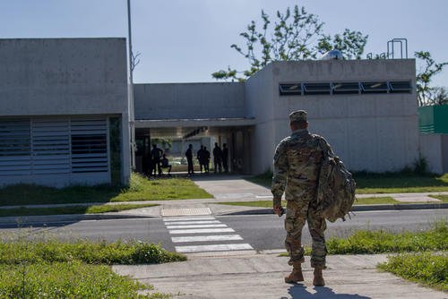 U.S. Army Reserve Officer Training Corps instructor arrives at the ROTC building on a university campus