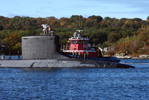 The USS Oregon (SSN 793) transits the Thames River after returning from routine operations in route to Naval Submarine Base New London in Groton, Conn.