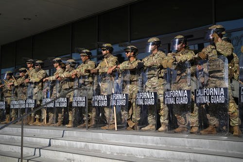California National Guard stand in formation guarding the federal building in downtown Los Angeles