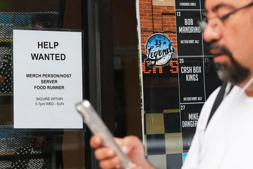 A help-wanted sign is displayed at a live music and blues club in Chicago.