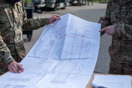 Students in the 346 Training Squadron use schematics