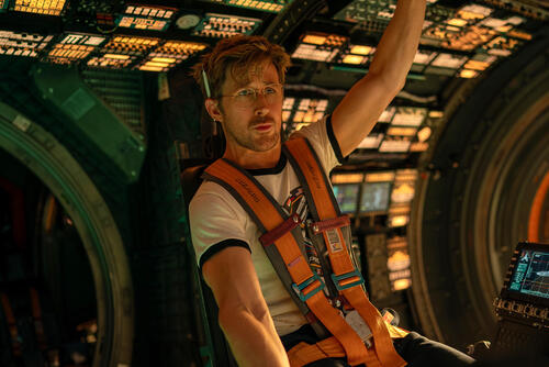 Actor Ryan Gosling strapped into a spacecraft cockpit in a scene from Project Hail Mary (2026).