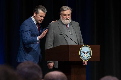 Defense Secretary Pete Hegseth, left, holds pastor Doug Wilson's shoulder during a Pentagon prayer service on Feb. 17. (Department of Defense)