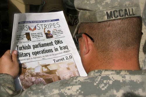 U.S. Army Sgt. Roger McCall, 153rd Military Police Company, reads an edition of the Stars and Stripes newspaper while in the Green Zone, Baghdad, Oct. 18, 2007.  (U.S. Army National Guard photo by Sgt. Brendan Mackie/Released)