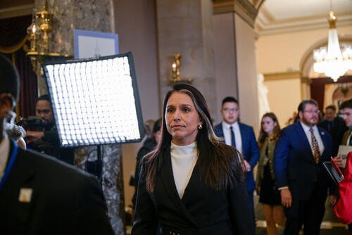 Director of National Intelligence Tulsi Gabbard exits the House chamber following President Donald Trump's State of the Union address to a joint session of Congress in the House chamber at the U.S. Capitol in Washington, Tuesday, Feb. 24, 2026. (AP Photo/Rod Lamkey, Jr.)