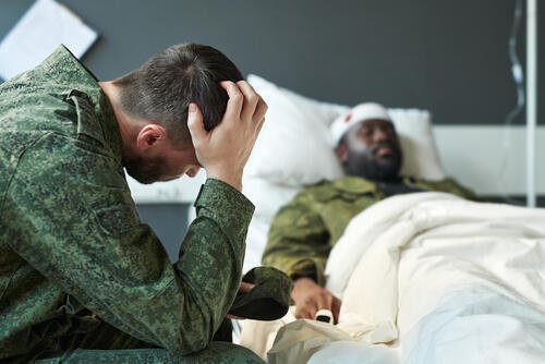 A soldier mourns an injury to a fellow service member. New legislation introduced March 9, 2026, could open the door for more psychedelics being used for a variety of conditions. (Shutterstock)