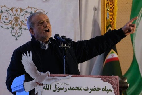Iranian President Masoud Pezeshkian speaks during a ceremony commemorating the death anniversary of the late commander of the Iran's Revolutionary Guard expeditionary Quds Force, Gen. Qassem Soleimani, who was killed in a U.S. drone attack in 2020 in Iraq, at the Imam Khomeini grand mosque in Tehran, Iran, Thursday, Jan. 1, 2026. (AP Photo/Vahid Salemi)
