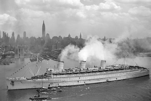 The British liner RMS Queen Mary arrives in New York harbor.
